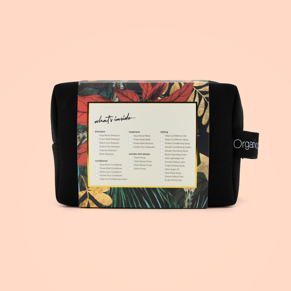 A black cosmetic pouch with a colorful floral label showing 'what's inside' and a side tag reading 'Organic', photographed on a solid pale peach background.